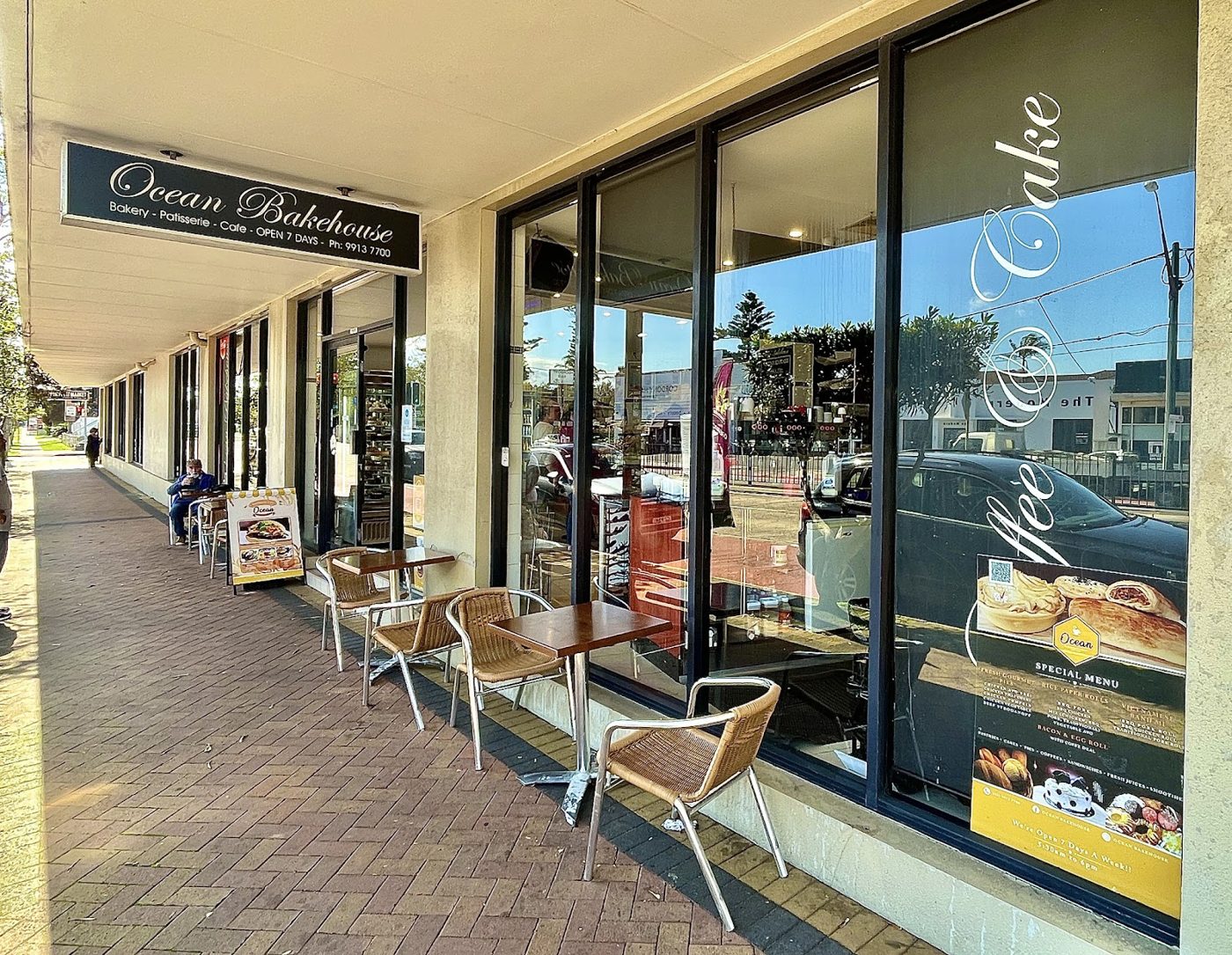 Ocean Bakehouse shopfront on Pittwater Road with tables out front